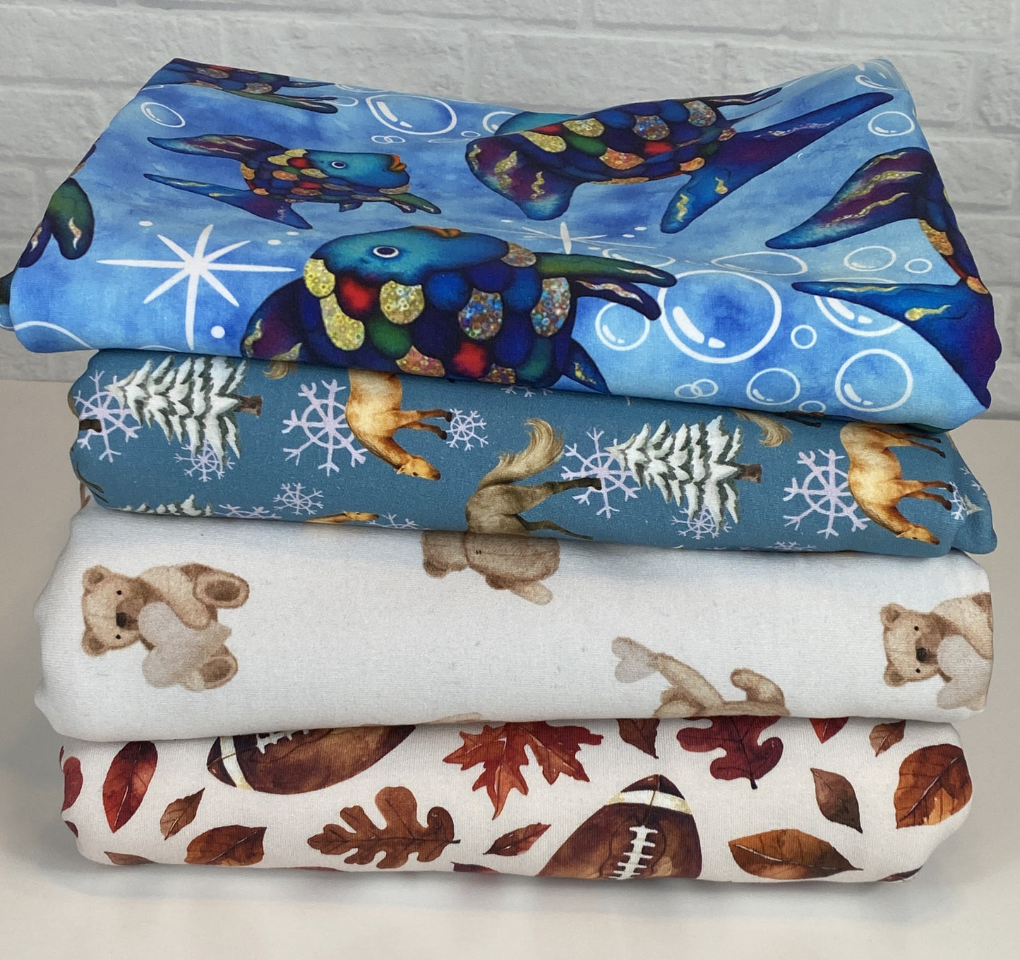 10 yard Fabric Bundle - Prints and Solids Bundle - European-Solids and Reactive-printed Prints - Cate and Rainn Football - Rainbow Fish (from book) - Winter Horses - Teddy w/gray hearts